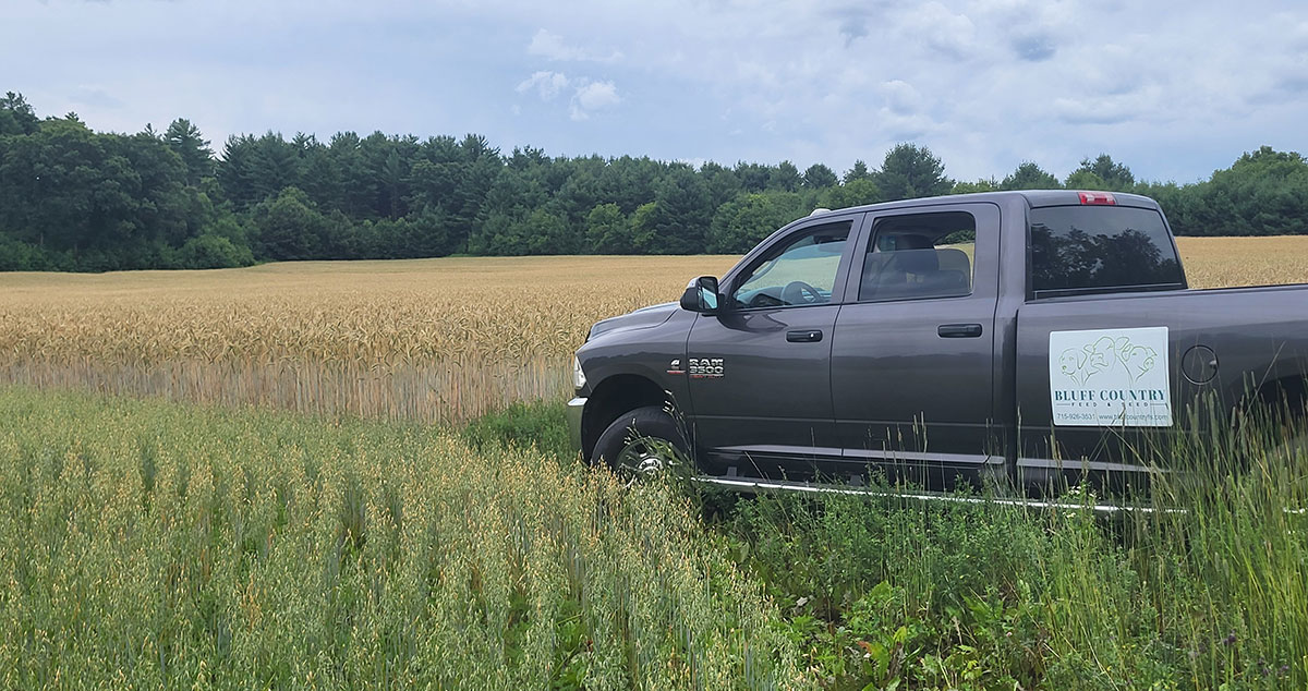 Bluff Country truck in field